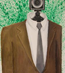 An audio speaker dressed in a suit