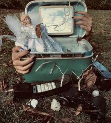 A photo of hands around a box on grass