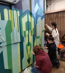 Students working on a set for a play